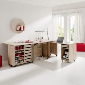 A well-lit room with complete set of sewing materials and furniture